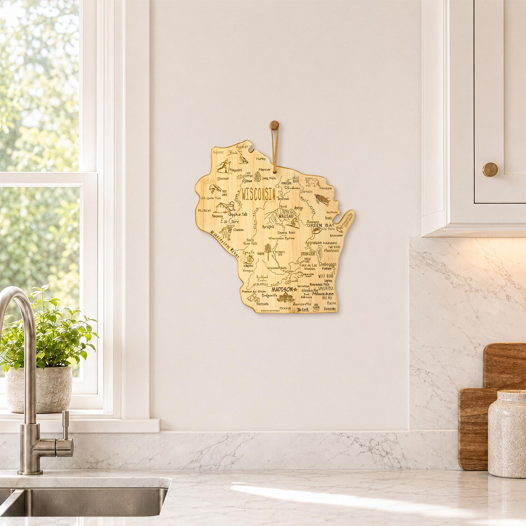 Totally Bamboo shown with utensils to display board size and scale