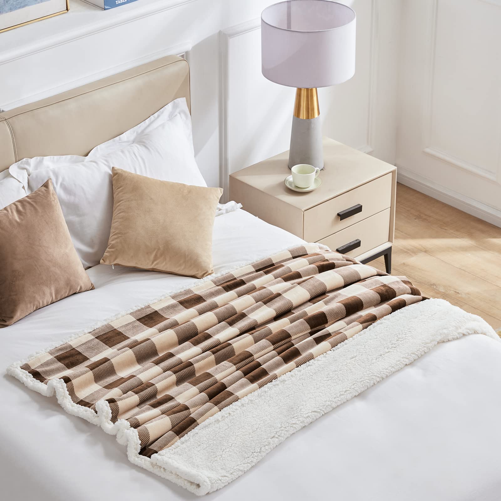 Touchat blanket draped over sofa offering soft comfort for lounging