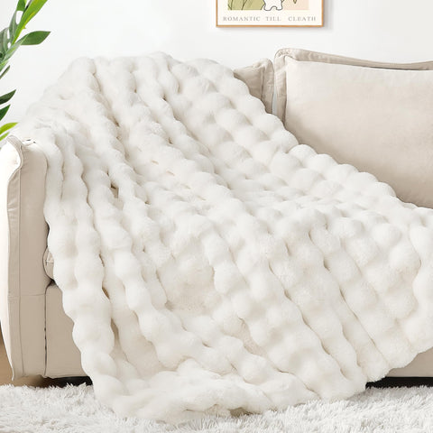 Touchat blanket draped on sofa styling a cozy living room atmosphere