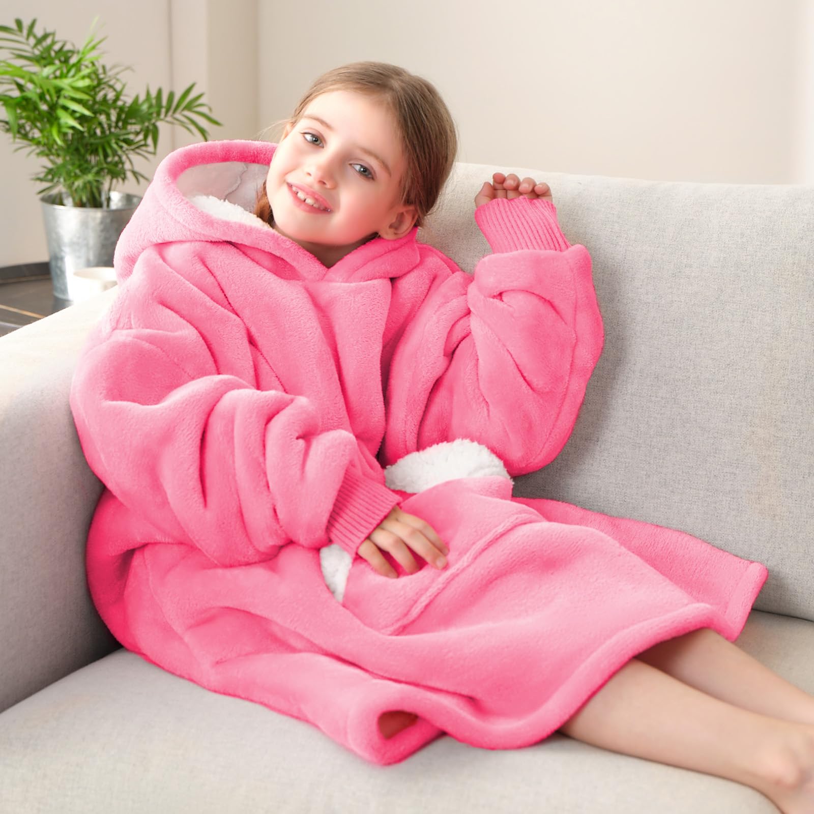 Touchat child wearing wearable blanket indoors showing mobility and comfort