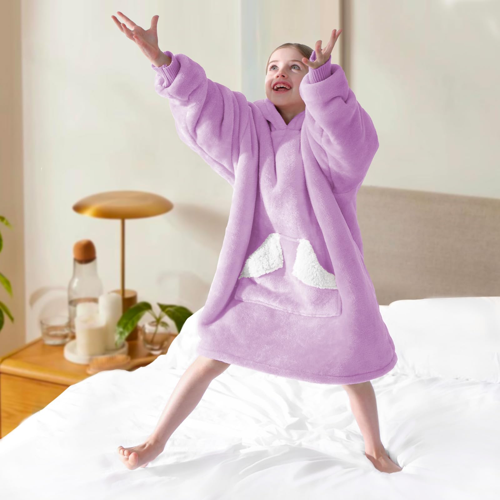 Child wearing Touchat blanket hoodie outdoors showing movement comfort