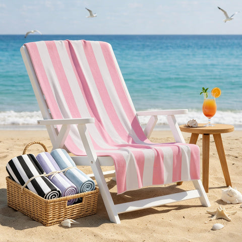 Touchat towel in use on sandy beach showing water-shedding and portability benefit