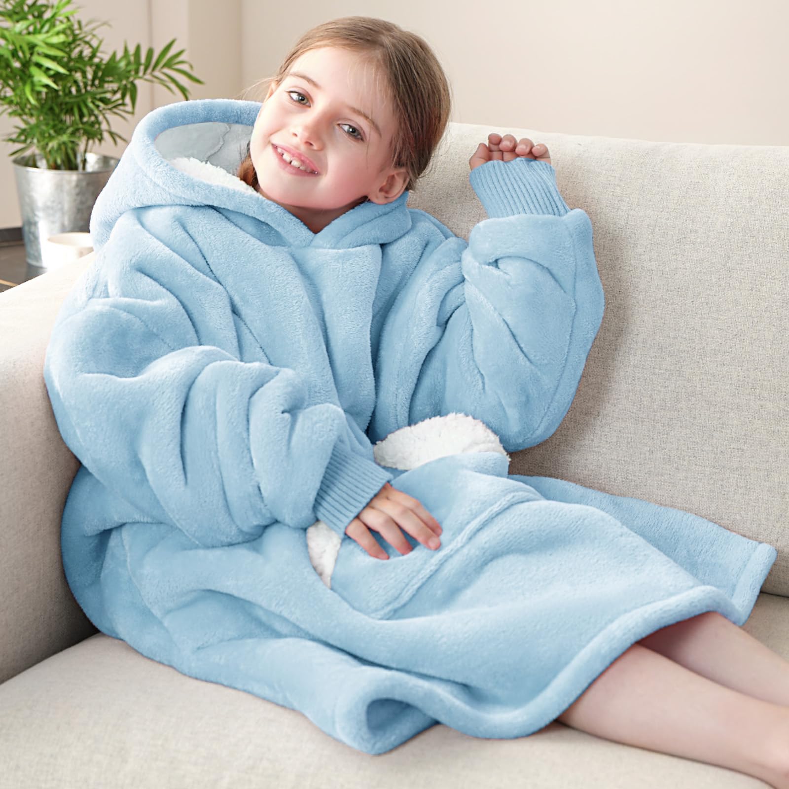 Touchat lifestyle shot of child on couch wearing hoodie for cozy lounging