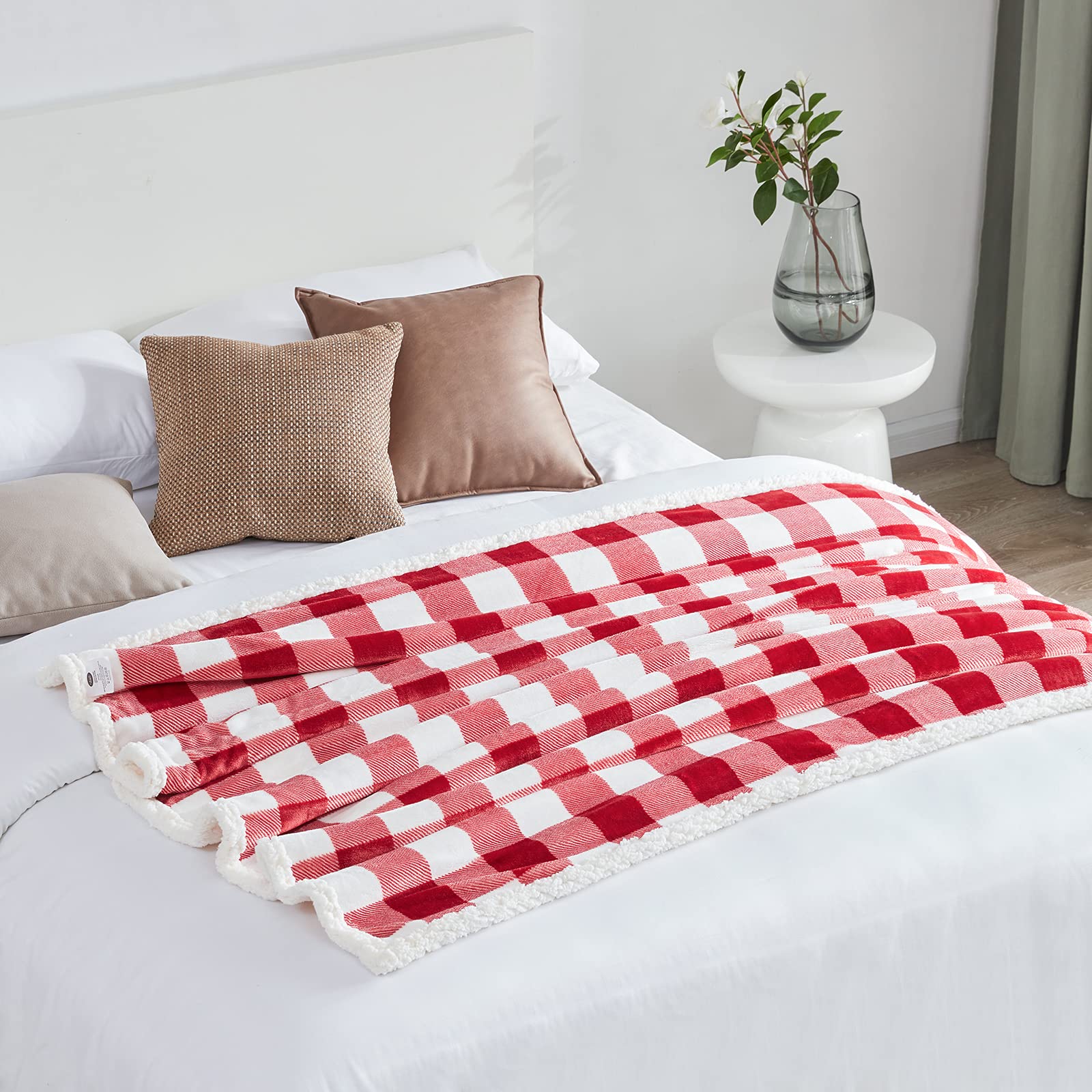 Touchat blanket laid on twin bed showing 60x70 inch coverage for beds or couch