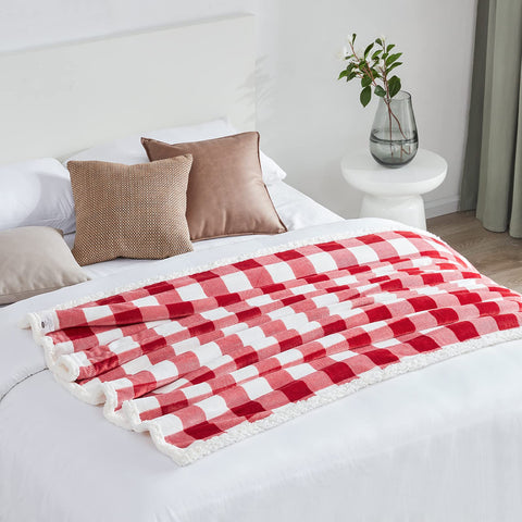 Touchat blanket laid on twin bed showing 60x70 inch coverage for beds or couch