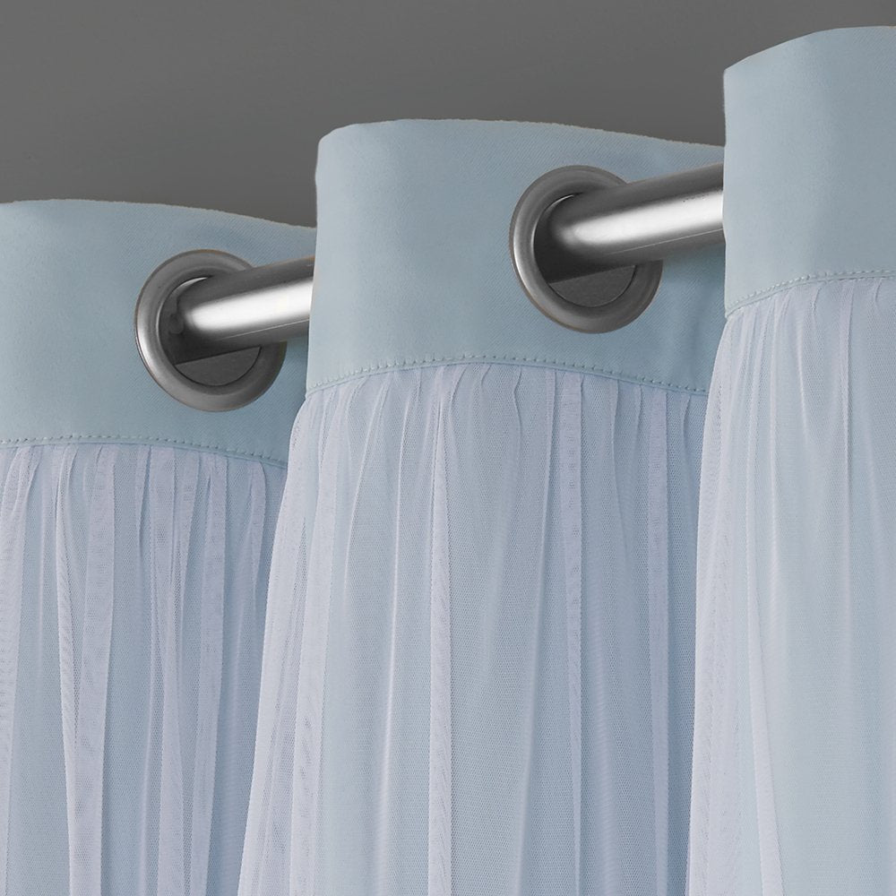TOWN & COUNTRY LUXE installed full-window aqua curtains creating polished room look