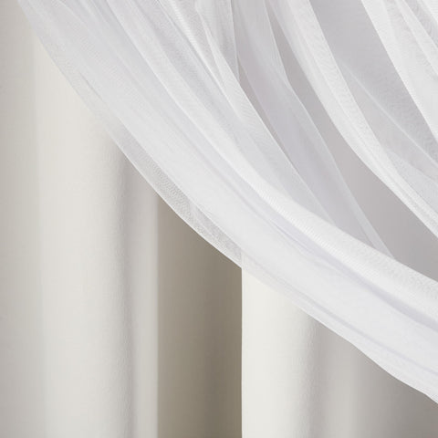 TOWN & COUNTRY LUXE curtain next to chair for scale showing full-length coverage benefit