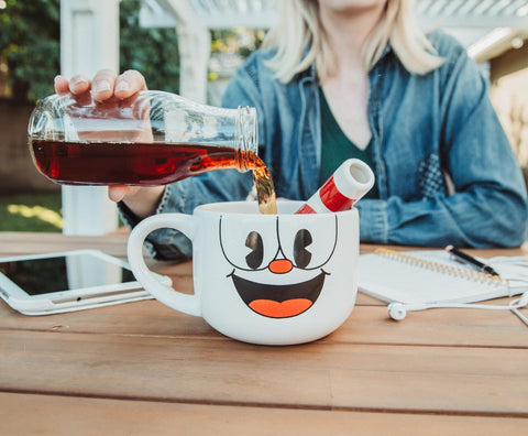 Toynk Cuphead in use with coffee emphasizes large capacity and practical use