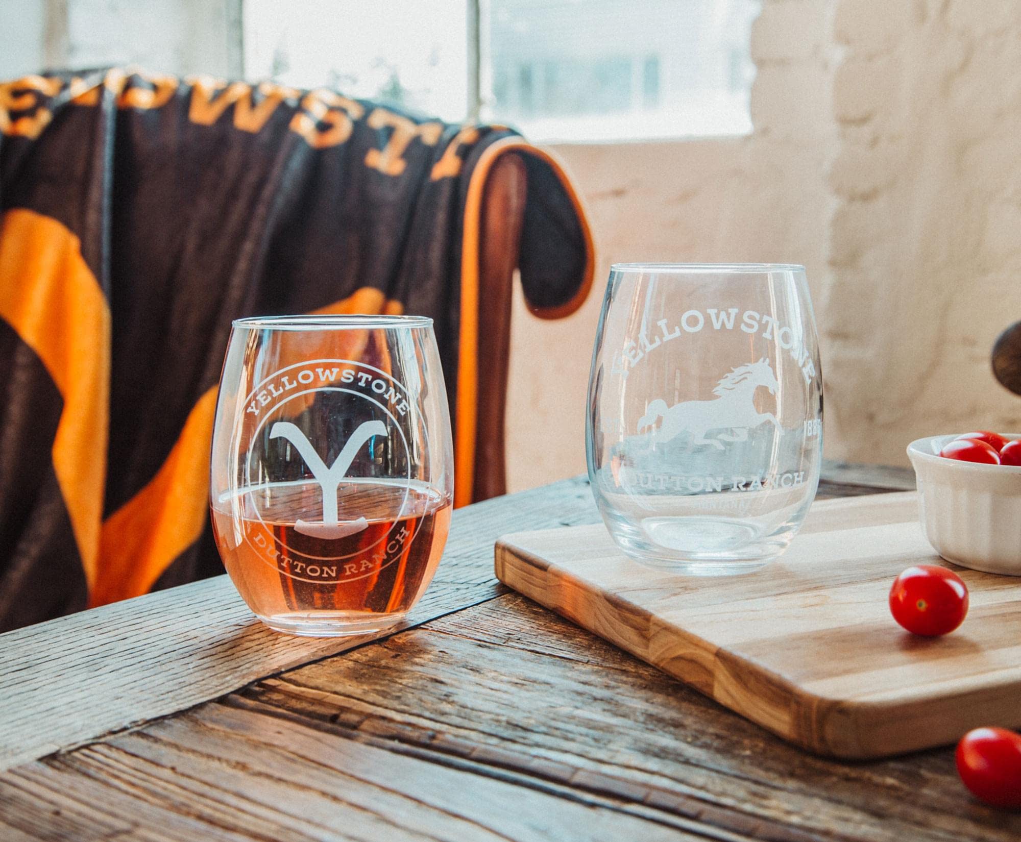 Toynk glass next to hand showing size and scale for comfortable grip benefit