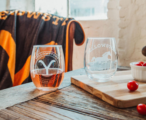 Toynk glass next to hand showing size and scale for comfortable grip benefit