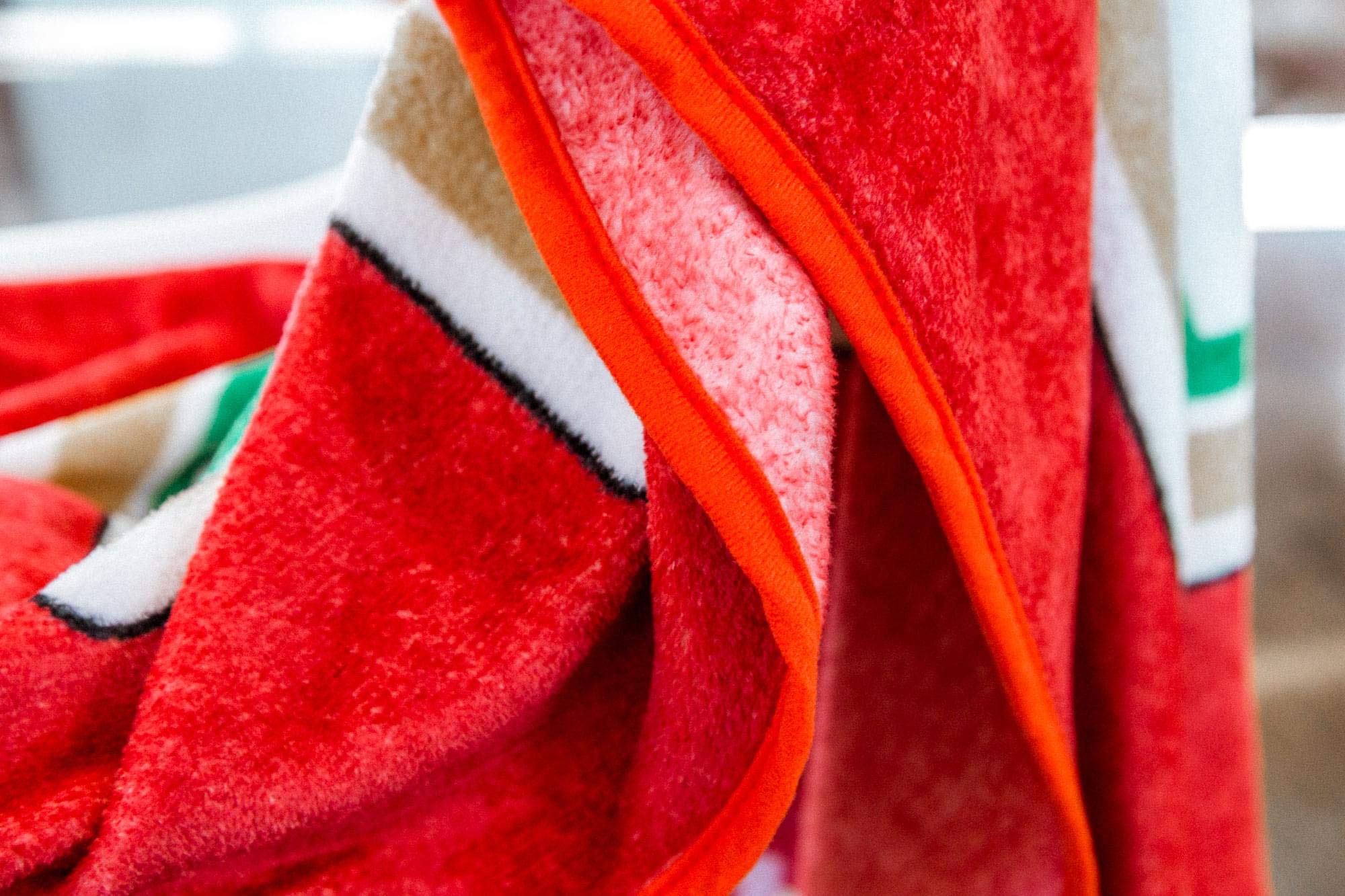 Toynk Heinz Ketchup throw draped over sofa in living room adding playful, eye-catching decor