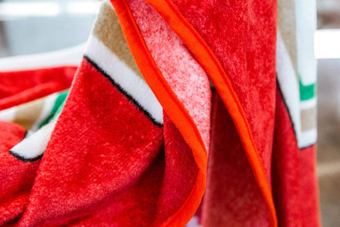 Toynk Heinz Ketchup throw draped over sofa in living room adding playful, eye-catching decor