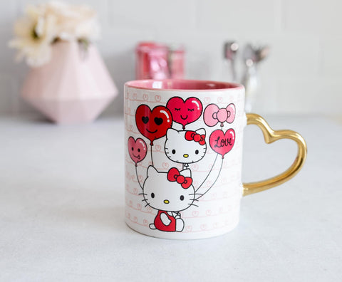 Toynk Hello Kitty beside a 14 oz scale to illustrate mug size and serving