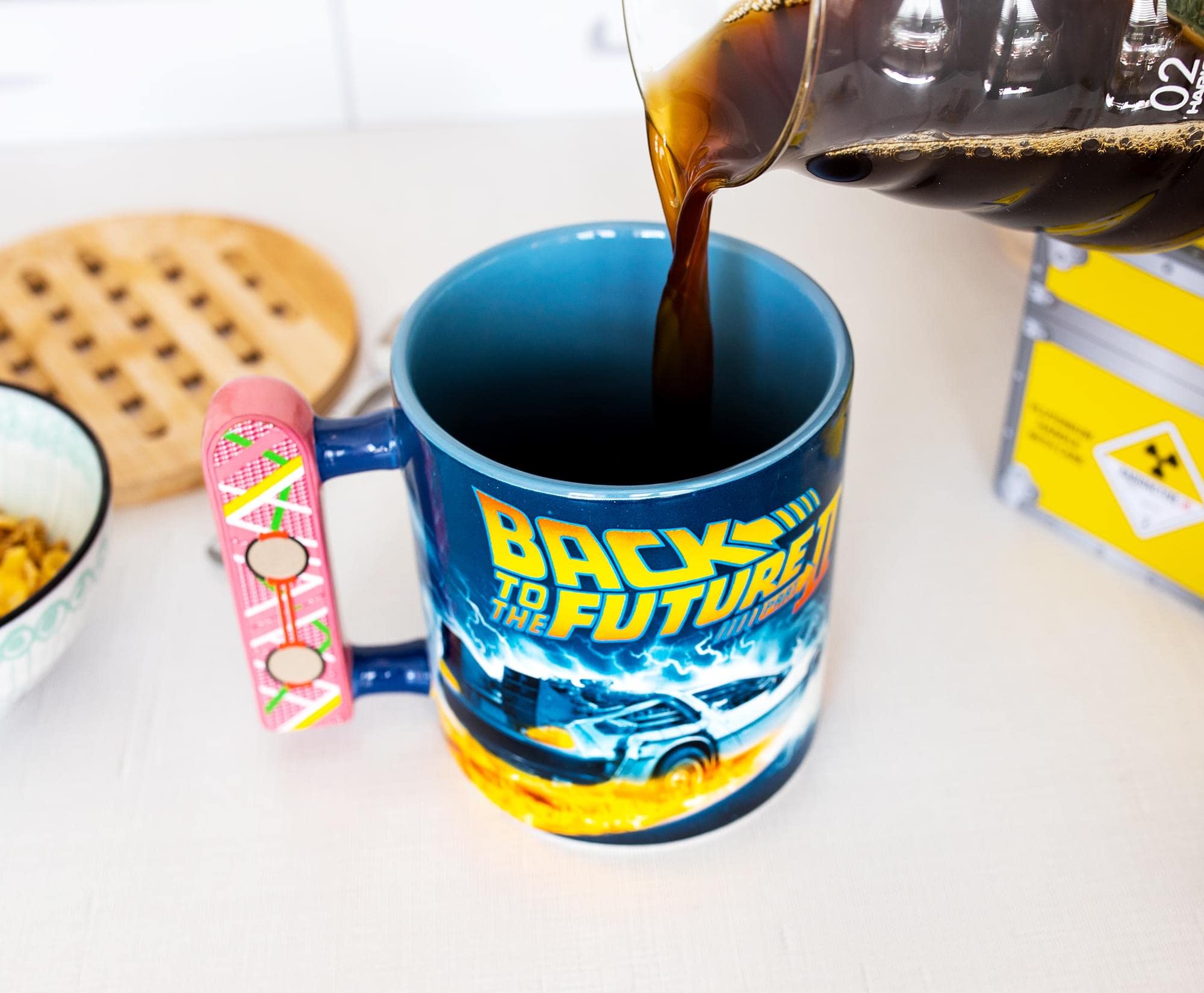 Toynk mug on desk with props showing collectible display and function