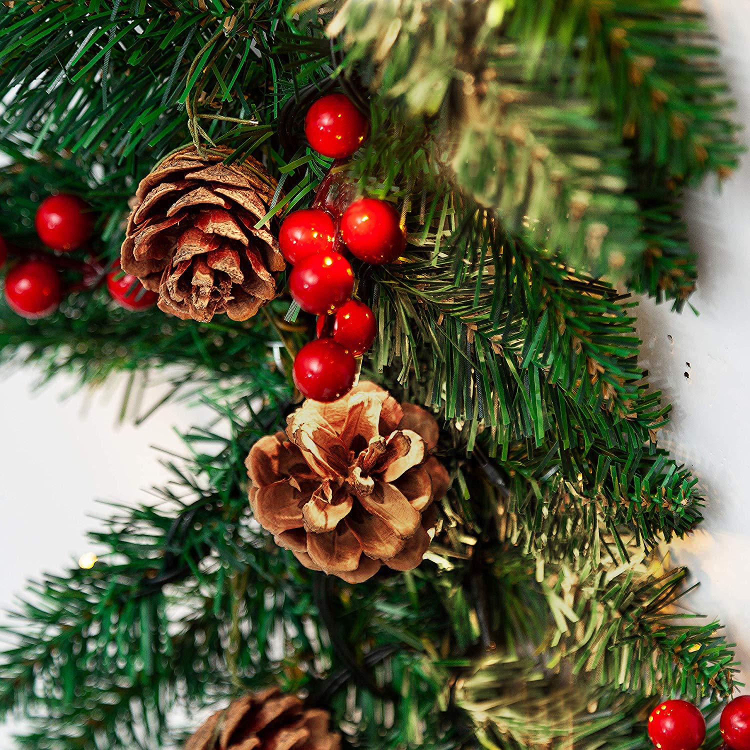 TQS pine cones and red berries detail adding seasonal color benefit