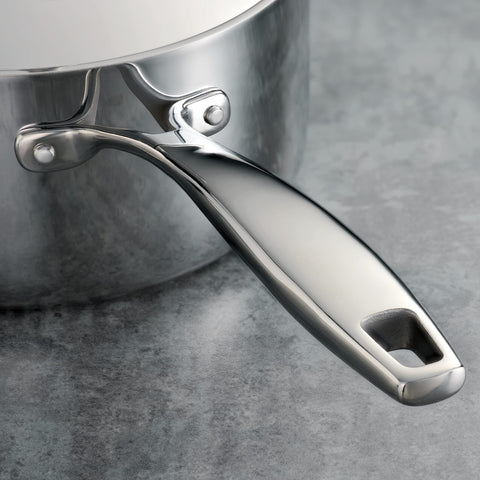 Tramontina saucepan in use simmering sauce to show precise temperature control