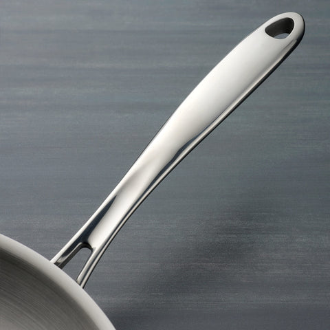 Tramontina interior surface close-up highlighting smooth stainless finish for easy release