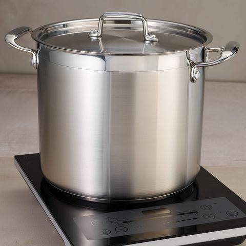 Tramontina next to utensils for scale showing true 16-quart capacity advantage