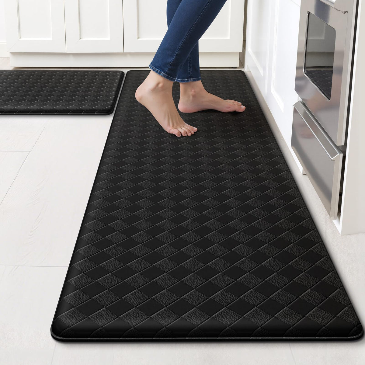 TranquilRelax front view of two black kitchen mats showing clean profile and benefit of floor protection