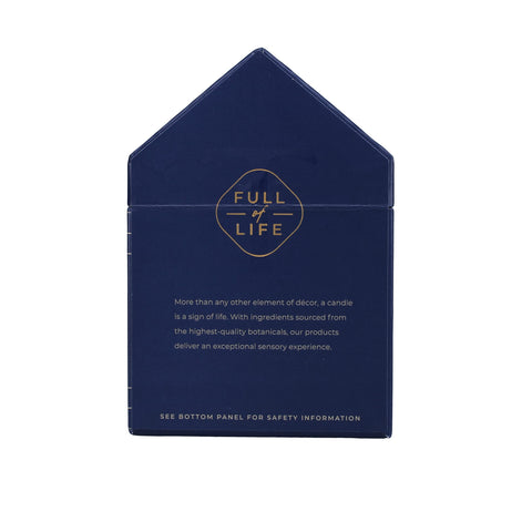 Trapp candle lit on bedside table creating cozy, calming atmosphere