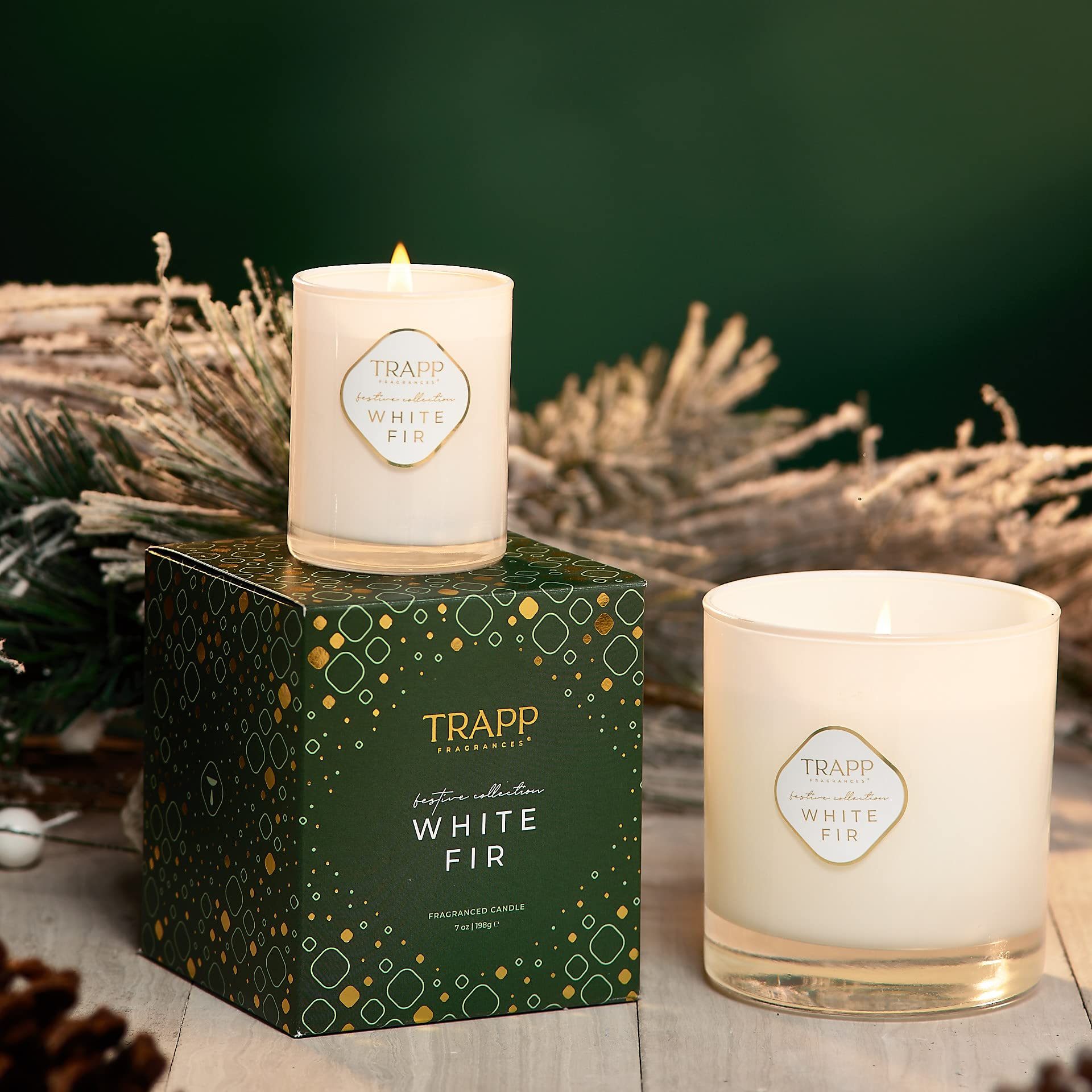 Trapp candle beside teacup for scale showing compact 7 oz size benefit