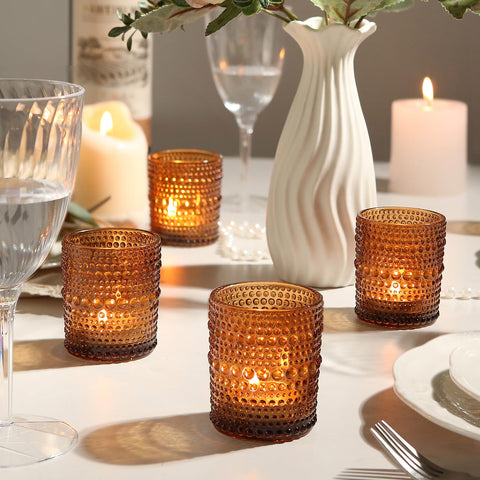TRIRITE lit tealight in amber holder on table creating cozy, ambient glow