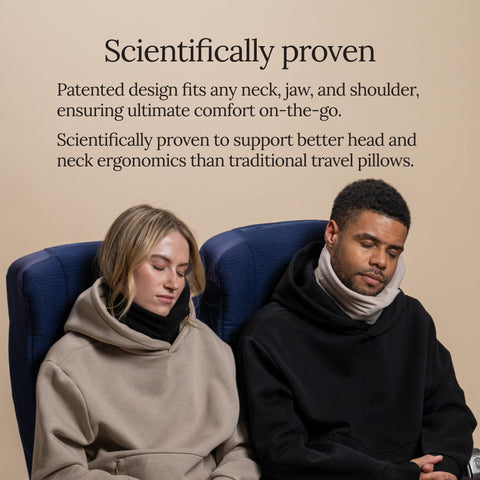 Person napping with Trtl pillow in cafe illustrating portable everyday use