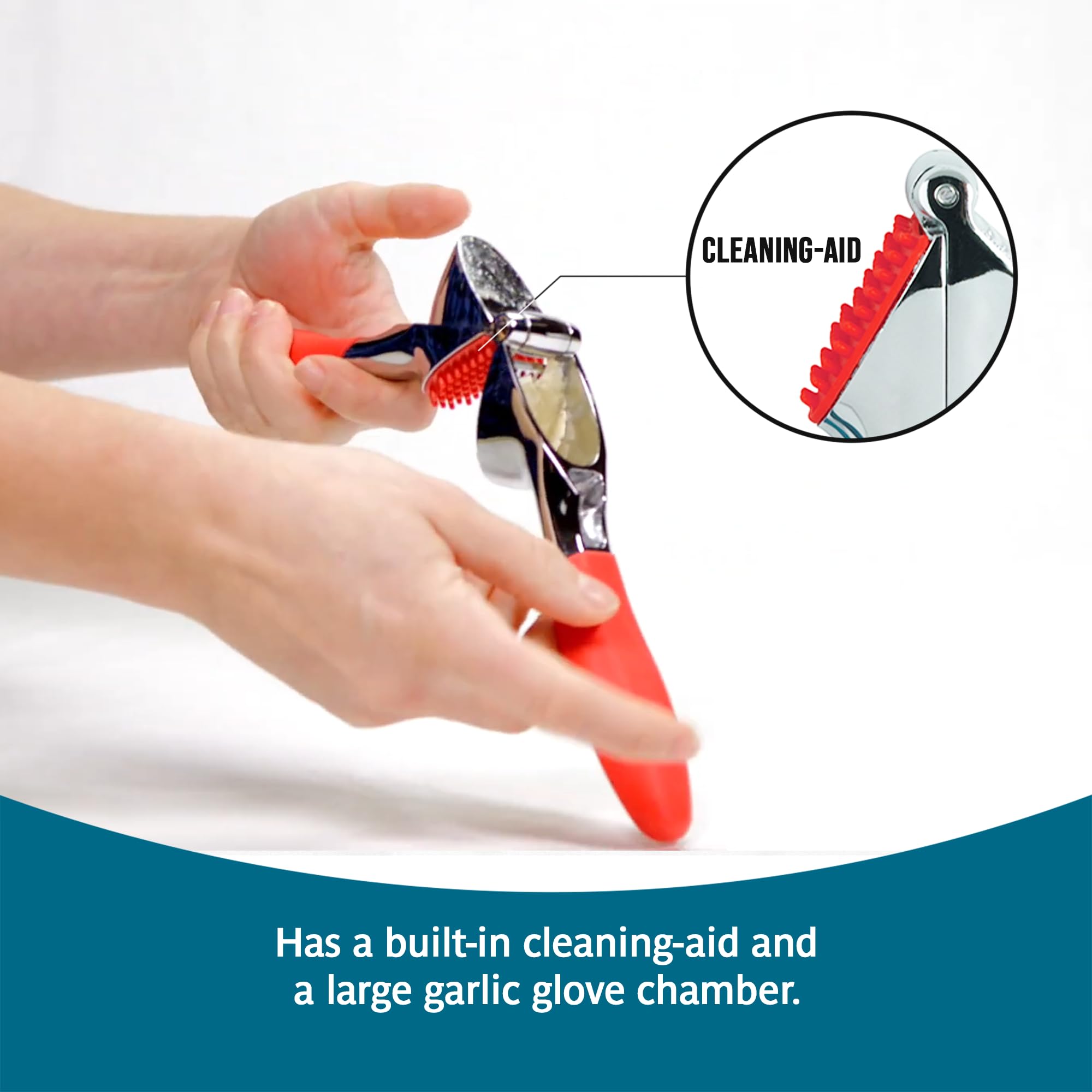 Trudeau garlic press chamber closeup revealing roomy clove capacity