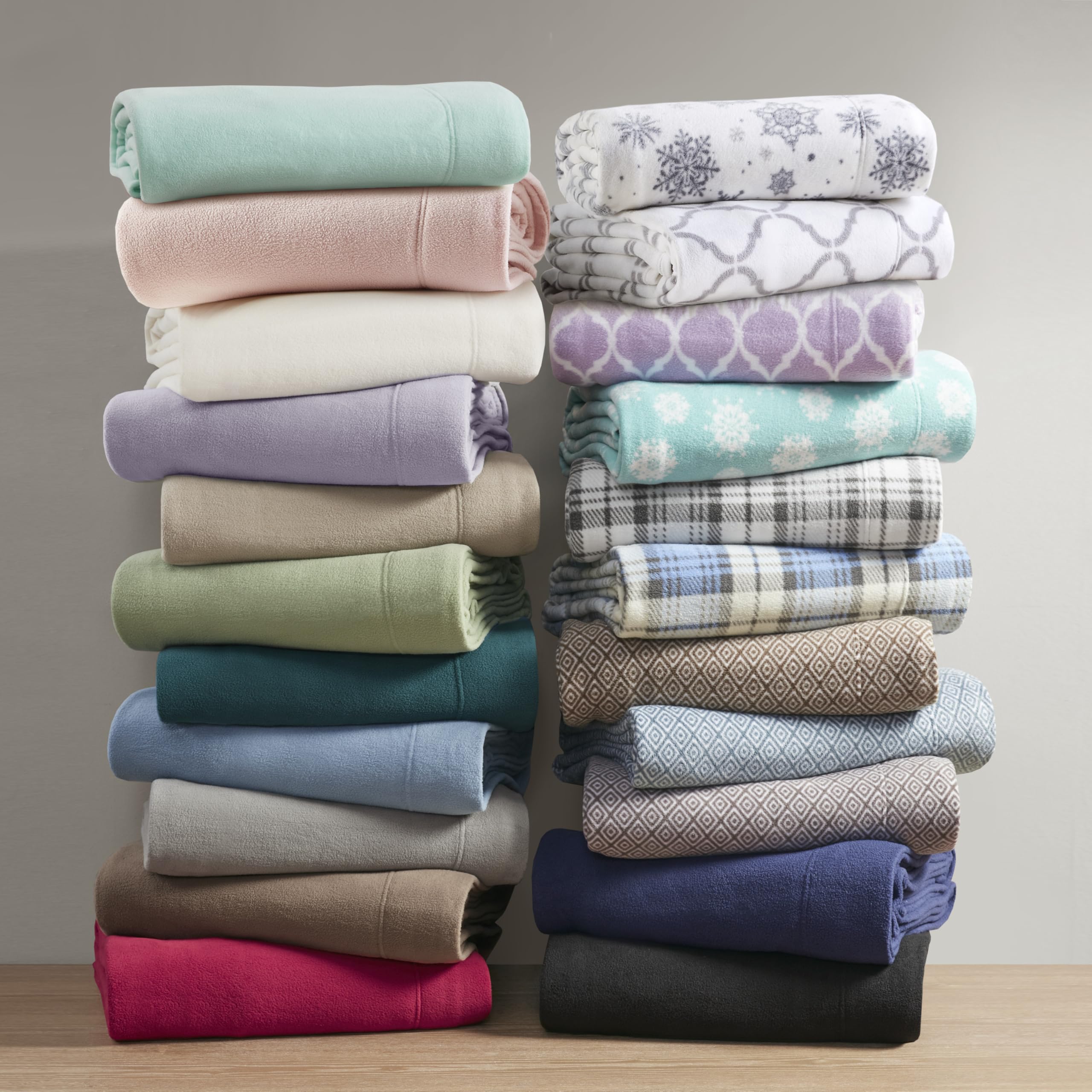 True North by Sleep Philosophy hand touching fabric to show tactile softness and comforting warmth