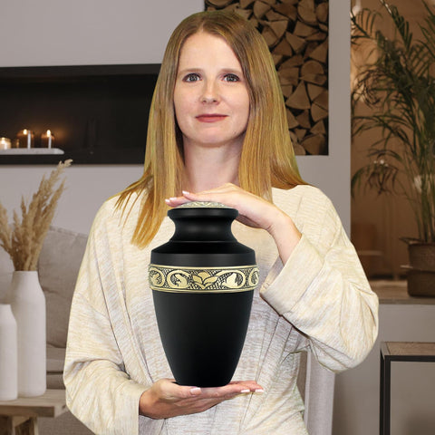 Trupoint Memorials urn beside hand for scale, shows adult-capacity portability