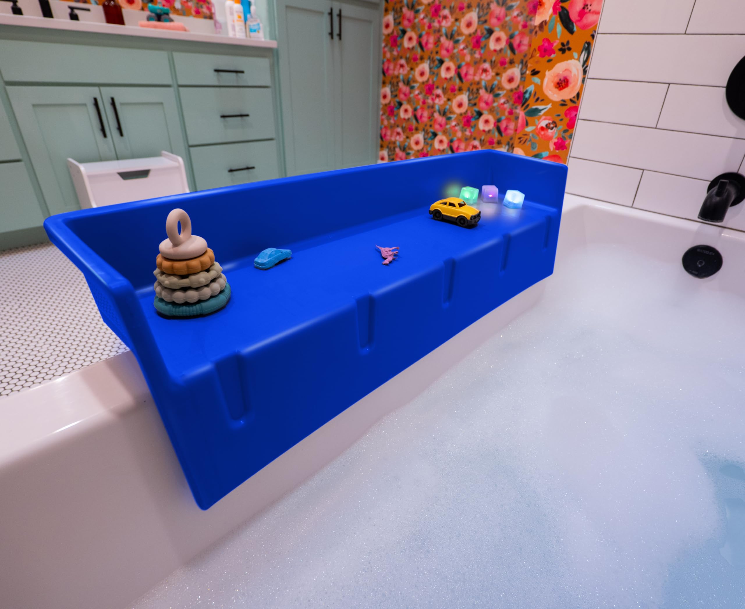 Tub Topper front view showing blue splash guard and organized shelf by Tub Topper, reduces mess