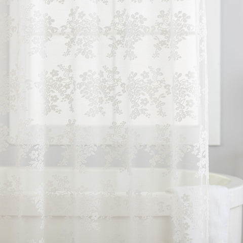 TUDECO scalloped edge hem showing refined finish and decorative silhouette