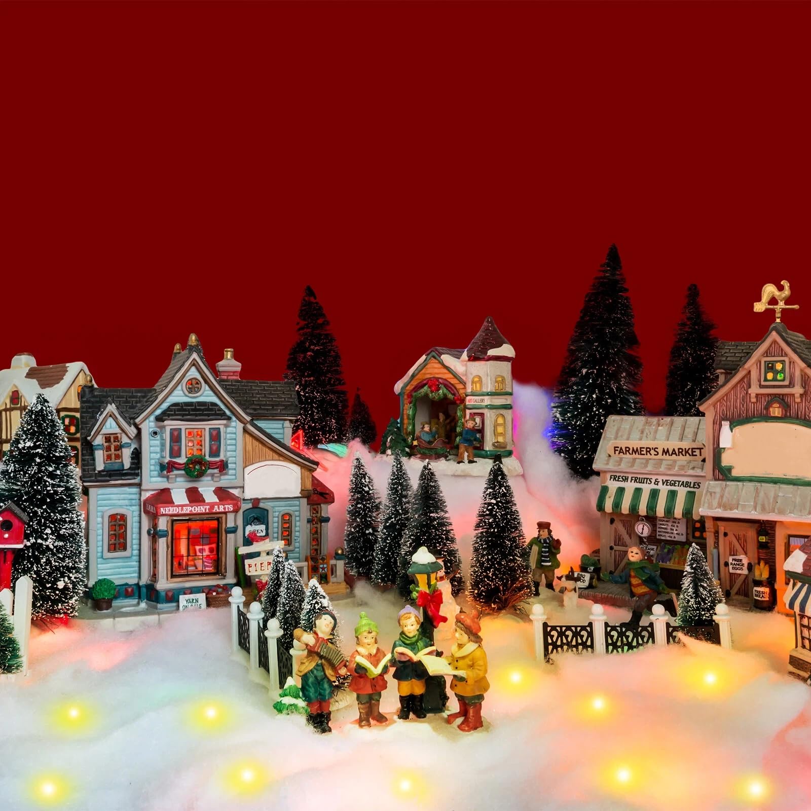 Tudomro mantel display with village scene creating cozy holiday atmosphere