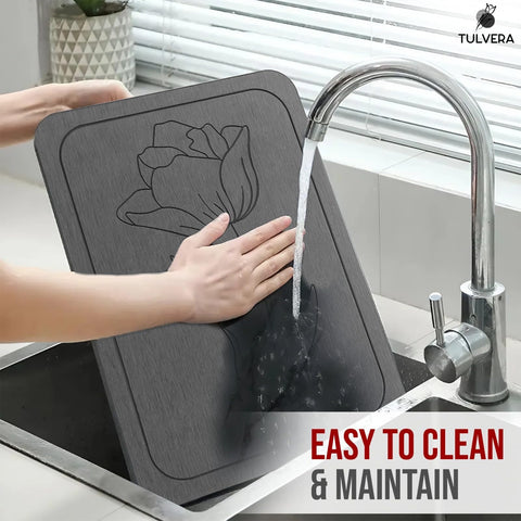 Tulvera mat beneath pet bowls illustrating water containment and easy clean benefit