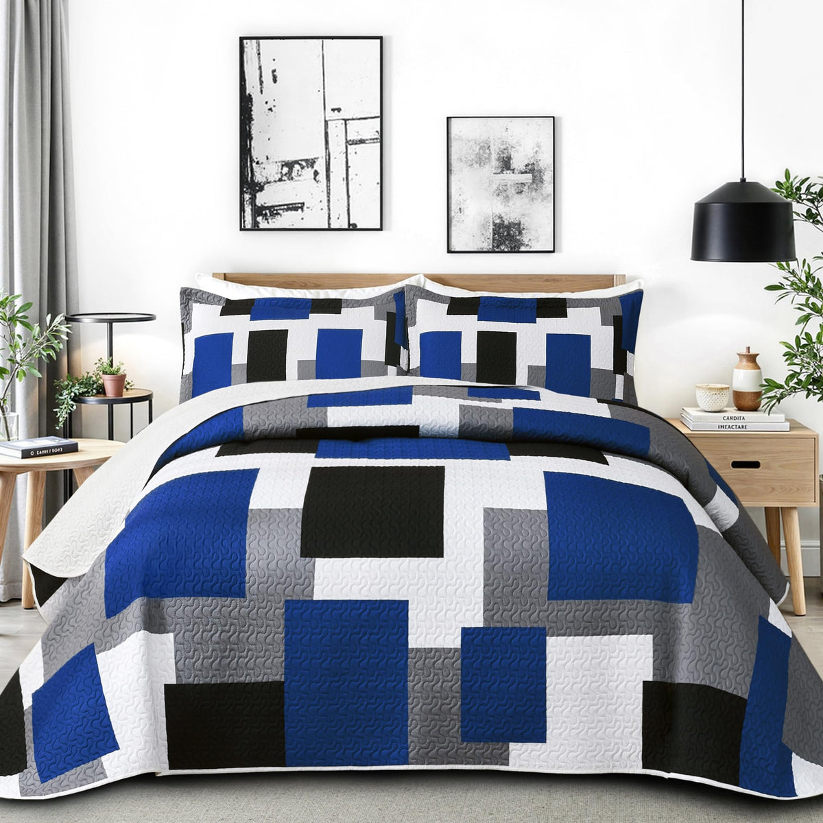 Tyrot front view of quilt on bed showing modern patchwork and refreshed décor