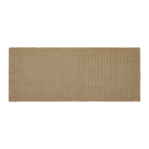 TYUU fabric label close-up showing material care and durable weave