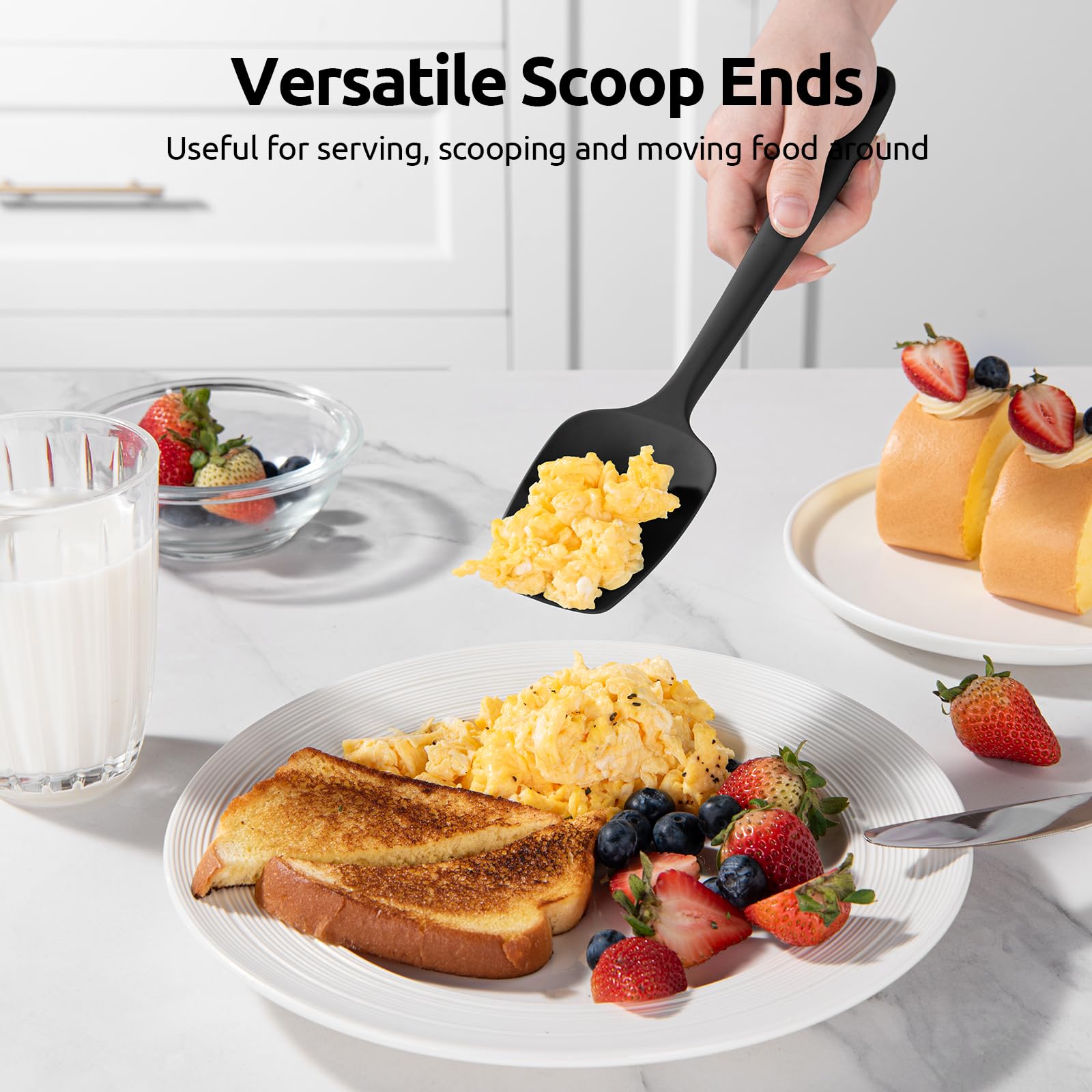 U-Taste spatulas lined on counter next to measuring cup for clear size comparison