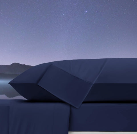 Ubauba body pillow styled on a bed to show restful sleep benefit