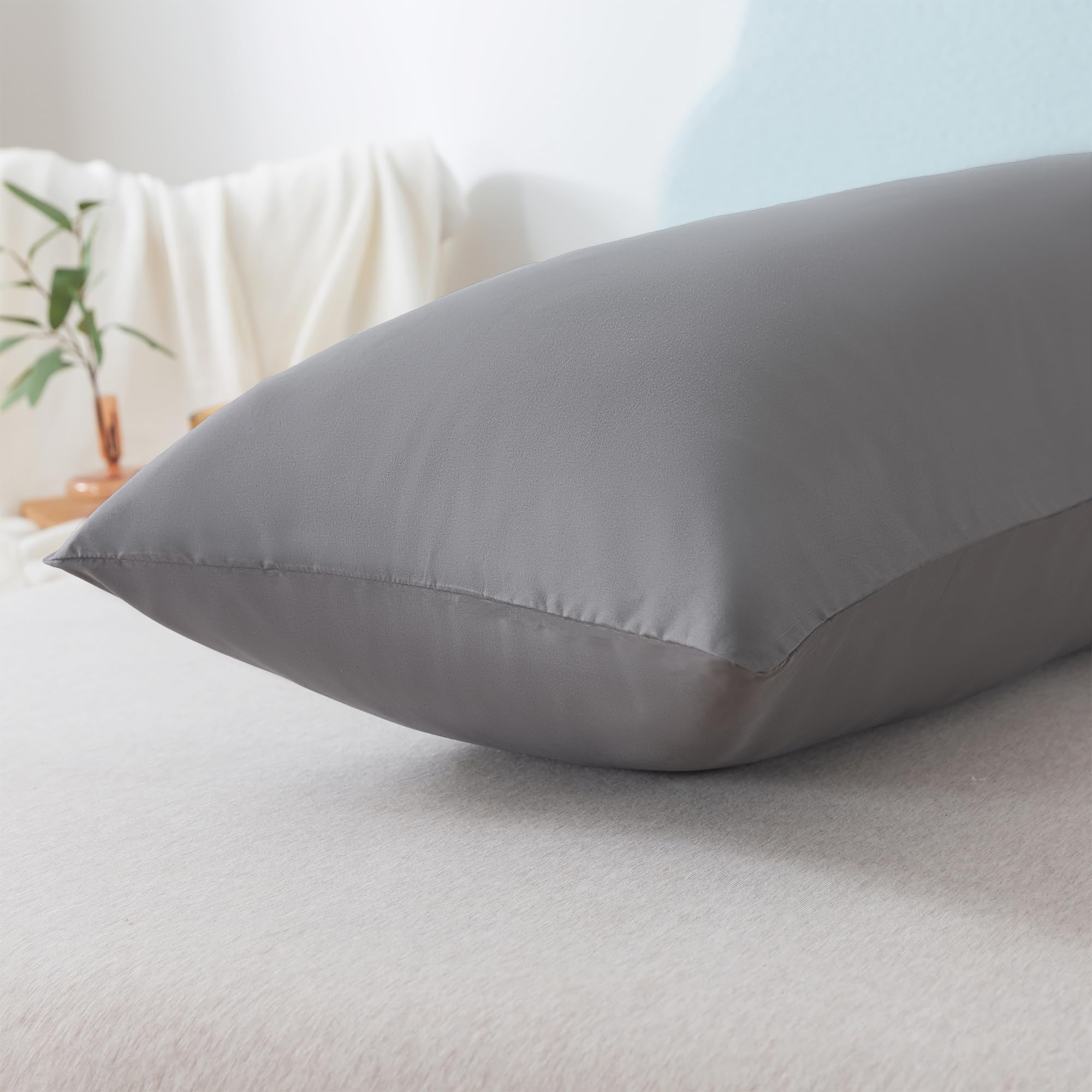 Ubauba size comparison on bed showing 20x54 inch scale and full-body coverage