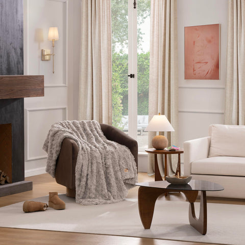 UGG Adalee draped on sofa in living room adding warmth and style