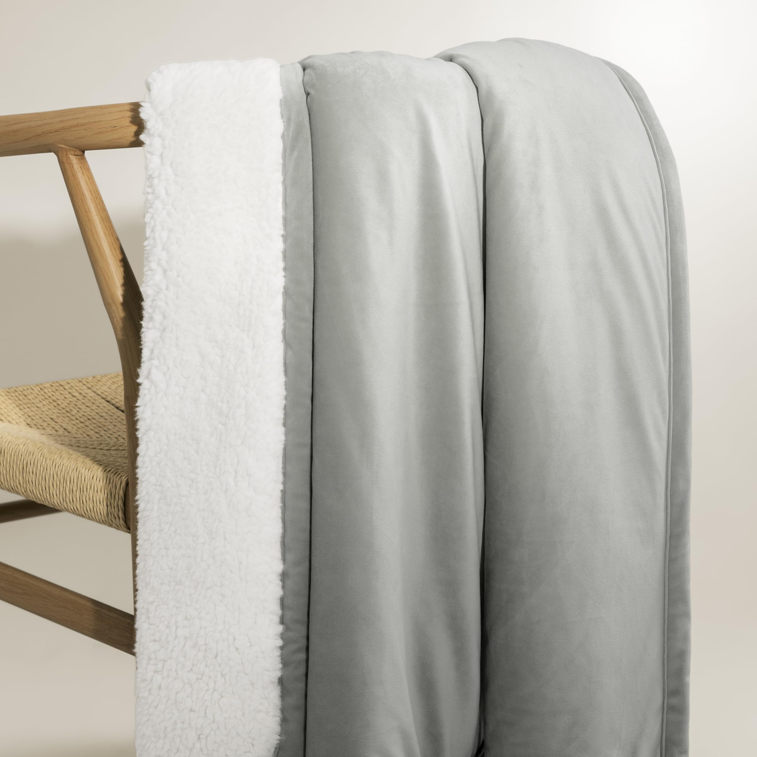UGG Bliss laid at foot of bed showing decorative layering benefit