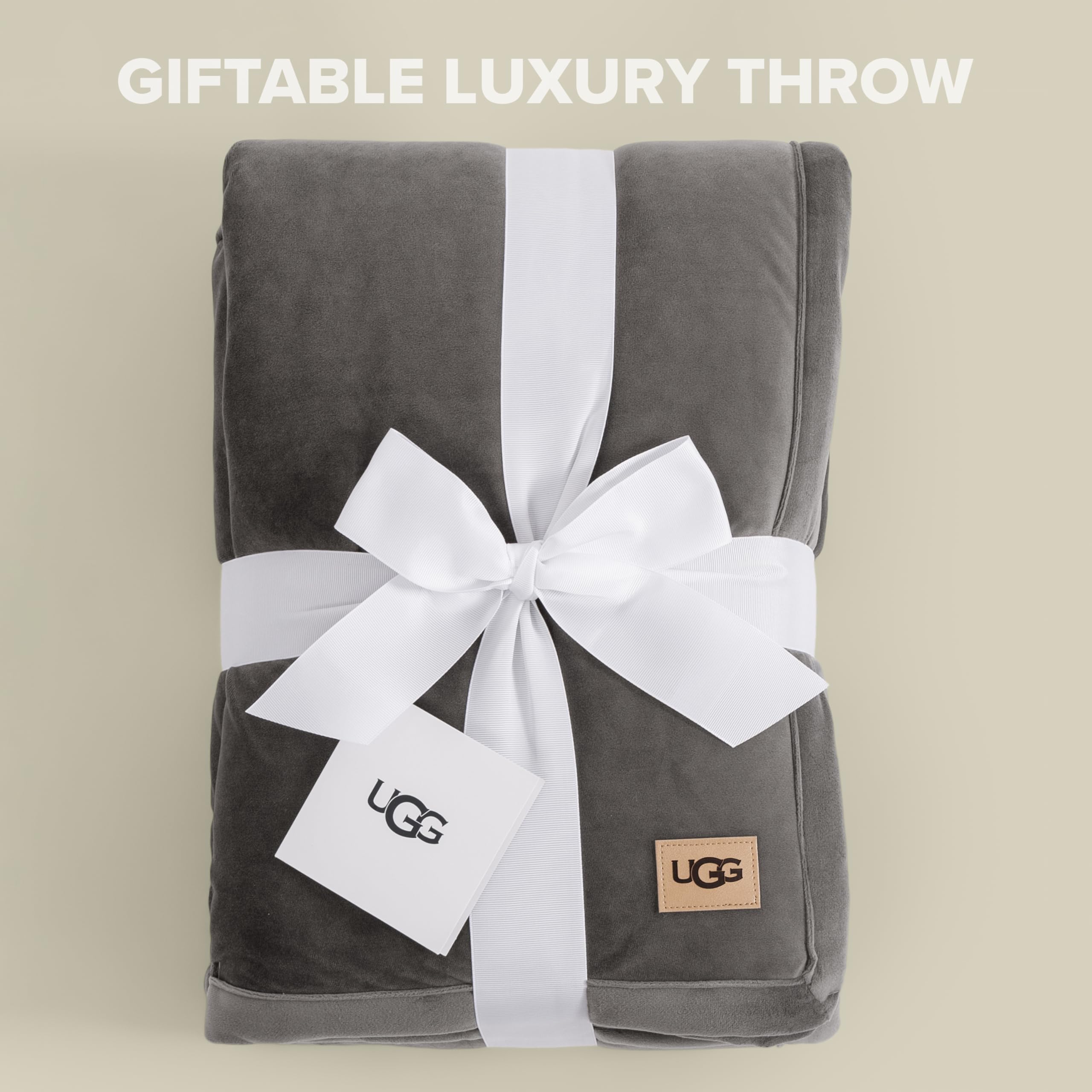 UGG throw draped over sofa adding texture and cozy living-room warmth