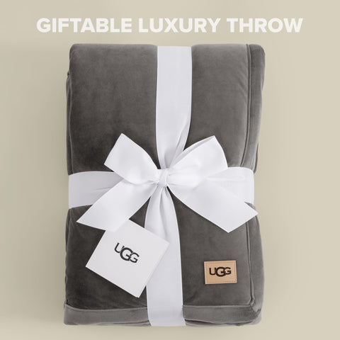 UGG throw draped over sofa adding texture and cozy living-room warmth