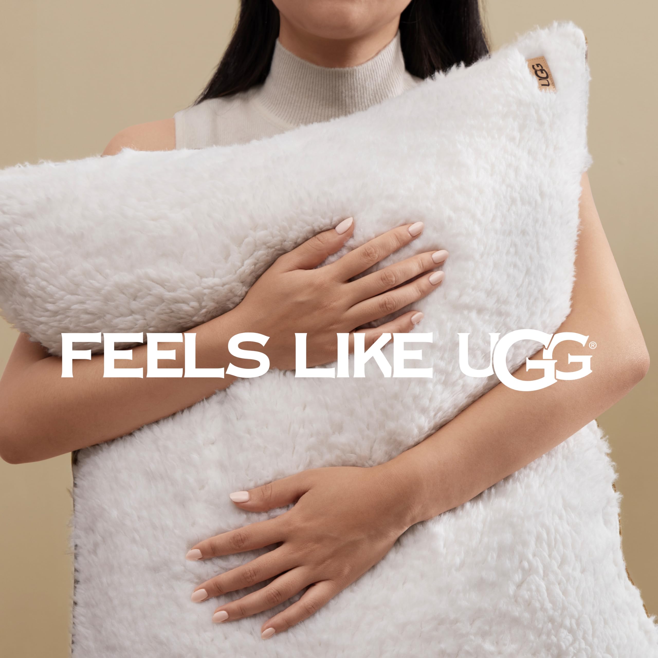 UGG comforter next to measuring tape illustrating 92 by 96 inch scale