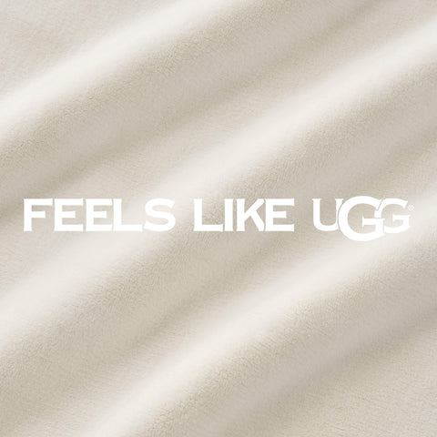 UGG Coco throw placed at foot of bed providing layered warmth benefit