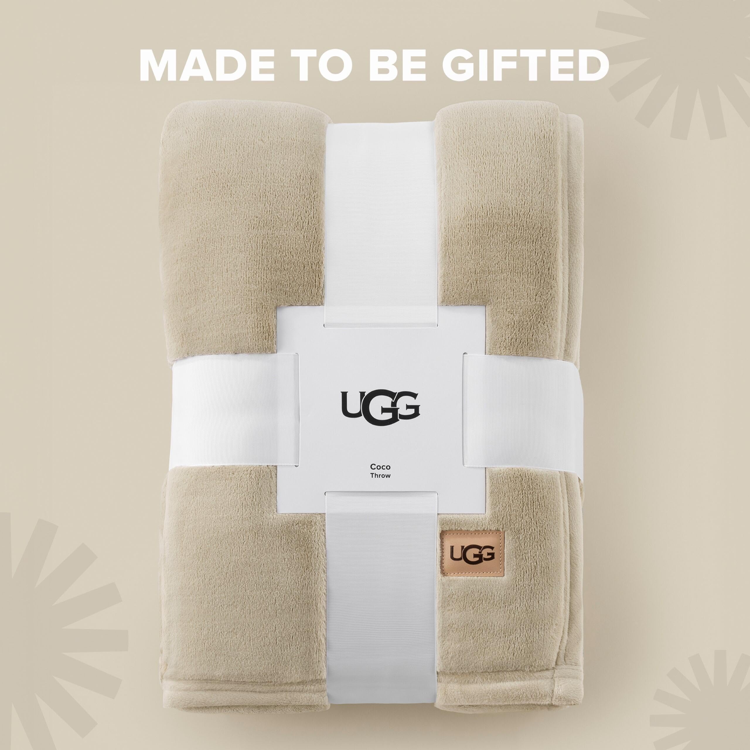 UGG Coco throw layered at foot of bed for decorative comfort