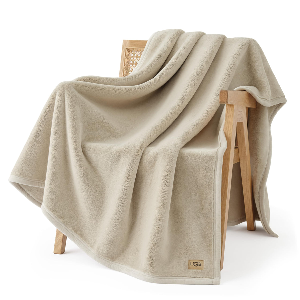 UGG Coco throw folded on table showing plush feel and cozy look