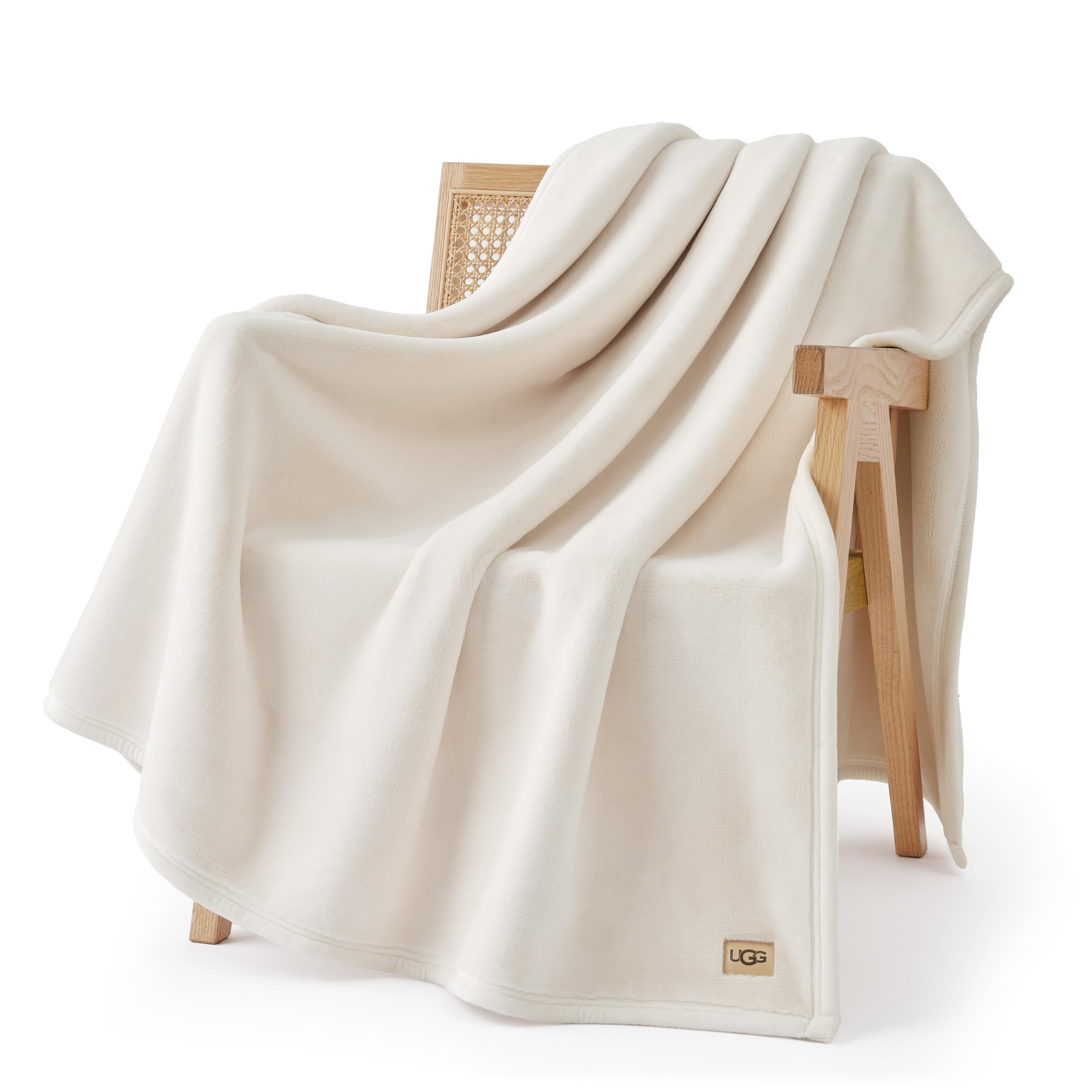 UGG Coco throw front view showing clean off-white finish and styling benefit
