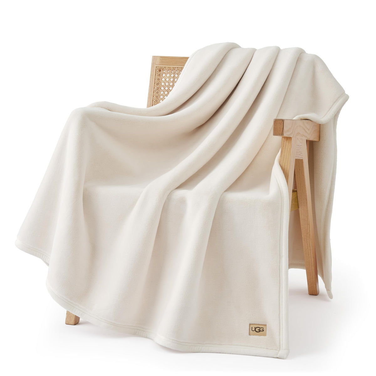 UGG Coco throw front view showing clean off-white finish and styling benefit