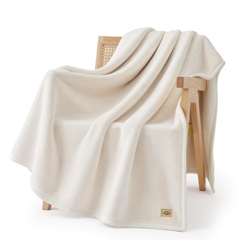 UGG Coco throw front view showing clean off-white finish and styling benefit